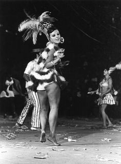 an old black and white photo of a woman dancing