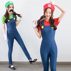 two young women dressed in mario and luigi costumes, one is holding her hair up