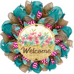 a welcome wreath with flowers on it