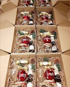 six boxes filled with assorted bottles of alcohol and christmas decorations on top of each box