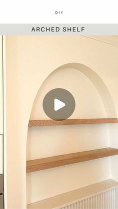 an arched shelf in the corner of a room