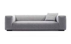 a gray couch sitting on top of a white floor