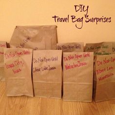 five brown bags with writing on them sitting on the floor in front of a wall that says diy travel bag supplies