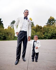 a man in a tuxedo standing next to a little boy