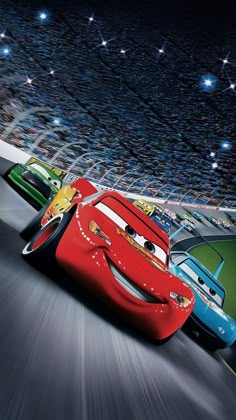 the cars are racing down the road in front of an audience at a movie theater