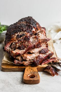 a large piece of meat sitting on top of a cutting board