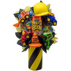 a vase filled with lots of toys on top of a white background, in the shape of a fireman's hat