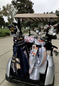 a golf cart filled with bags and clubs