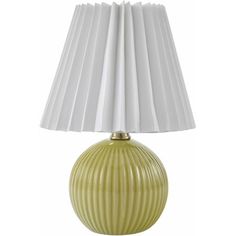 a green lamp with white pleated shades on the base and a white shade on the top