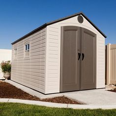 a storage shed with two doors on the side