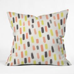 a white pillow with an orange, black and yellow pattern