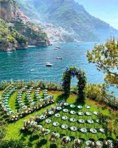 an aerial view of a lawn with tables and chairs set up in the shape of a heart