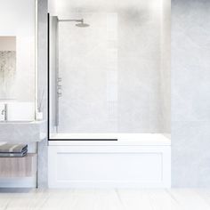 a white bathroom with a glass shower door