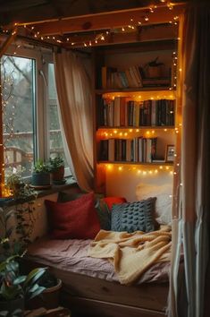 a bed with bookshelves and lights in the corner, next to a window