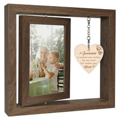 a wooden photo frame with a heart shaped keychain hanging from it's side