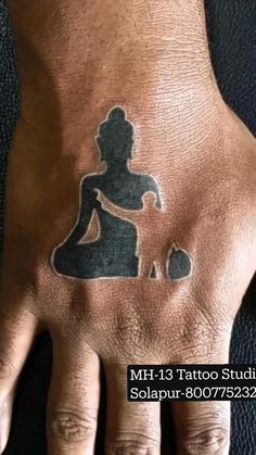 a person's hand with a tattoo on it