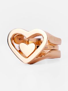 Introducing our first-of-a-kind heart-shaped beauty: the Kiota 3-in-1 Ring. This versatile design features two rings that can be worn together or separately, offering a multi-functional style. A smaller solid ring nestles gracefully inside the larger hollow ring, creating a stunning statement piece. You can effortlessly switch between bold style and everyday wear, wearing it solo or layering for a personalized look. Rose Gold Heart-shaped Stackable Rings, Elegant Stackable Open Heart Rings, Modern Heart Shaped Promise Ring, Modern Heart-shaped Promise Ring, Modern Heart-shaped Rings For Valentine's Day, Modern Heart-shaped Wedding Rings, Modern Double Heart Jewelry For Anniversary, Modern Heart-shaped Anniversary Rings, Modern Heart Shaped Anniversary Rings