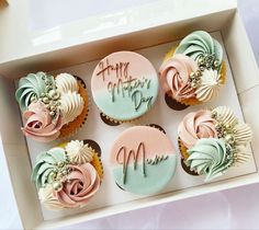 six decorated cupcakes in a box with happy mother's day written on them