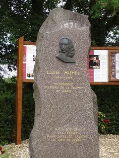 there is a large stone with a bust on it