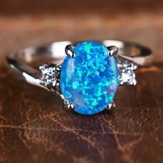 Elegant Opal Ring Sunset On The Beach Color Blue With Simulated Diamonds Showing Off Personality Match Daily Outfits Perfect For Any Occasion And Makes The Perfect Gift Sunset On The Beach, Blue Ring, Beach Color, Opal Ring, Blue Rings, Blue Opal, Ladies Boutique, Opal Rings, Womens Jewelry Rings