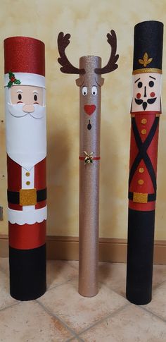 three christmas decorations made out of toilet paper tubes and santa clause, reindeer, and nutcracker