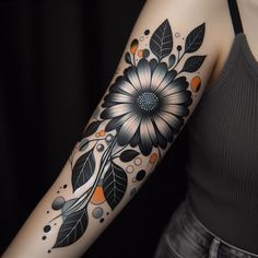 a woman's arm with a flower and leaves tattoo design on the left arm