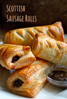 scottish sausage rolls on a plate with dipping sauce