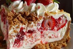 a piece of strawberry cream pie on a plate with strawberries and whipped cream topping