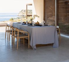 the table is set with plates and glasses