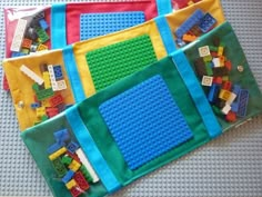 legos are laid out on the floor to be used as placemats or wall hangings