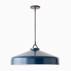 a blue light hanging from a ceiling fixture on a white background with no one in it