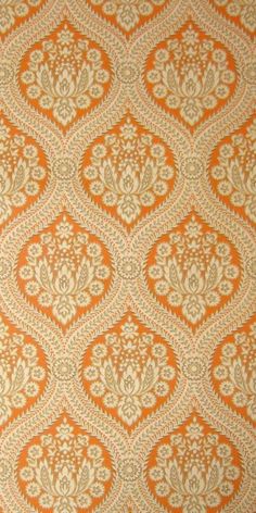 an orange and white wallpaper with ornate designs