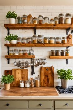 a kitchen with wooden shelves filled with pots and pans on top of the stove