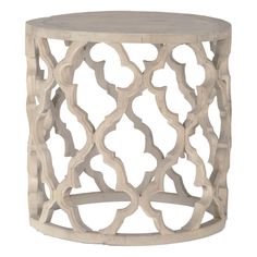 a white wooden table with an intricate design on the top and bottom, against a white background