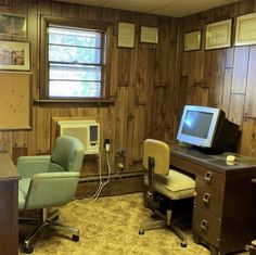 an office with a desk, chair and computer monitor