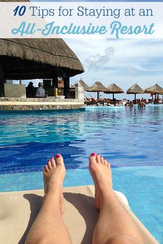 a person's feet in the water at an all - inclusive resort