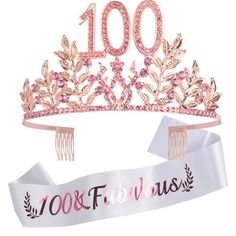 a pink tiara with the words 100 and fabulous on it, next to a ribbon