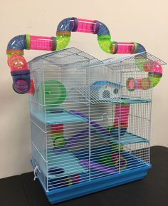 a small bird cage sitting on top of a table