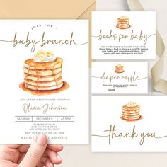 the baby brunch is being held up in front of some cards with gold lettering