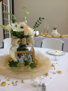 a vase filled with flowers sitting on top of a table next to a plate covered in confetti