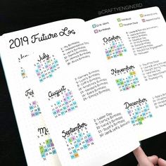 someone is holding up a planner with the dates for their upcoming events on it's page