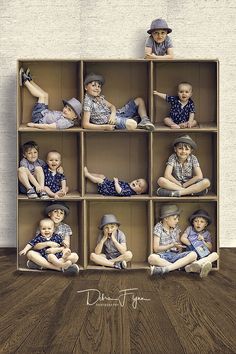 a group of children sitting in a wooden box on top of wood floored floors