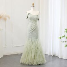 Upgrade your wedding party look with our Sparkly Sage Green Mermaid Evening Dress. The shimmering fabric and mermaid silhouette will make you stand out while the sage green color adds a touch of elegance. Perfect for formal events, this dress is sure to make you feel like a true mermaid. window.adminAccountId=244214477; Green Mermaid Gown With Sweep Train, Green Fishtail Mermaid Dress With Fitted Bodice, Mermaid Wedding Dress With Sweep Train, Green Mermaid Dress With Fitted Bodice, Green Mermaid Gown For Prom Season, Wedding Mermaid Dress With Sweep Train, Fitted Green Fishtail Gown, Green Mermaid Dress With Sweep Train, Green Mermaid Hem Gown For Prom Season