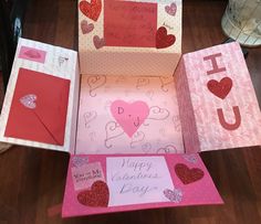 valentine's day greeting cards and envelopes are on the floor