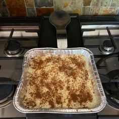 a casserole sitting on top of a stove in a pan