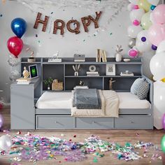 a bedroom with balloons and confetti on the floor