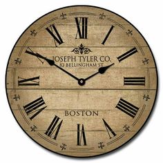 a large wooden clock with roman numerals and the words joseph tyler co and bellingham sons