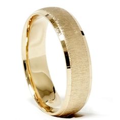 a yellow gold wedding ring with a textured finish on the outside and inside of it