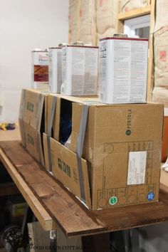 boxes are stacked on top of each other in the middle of a workbench