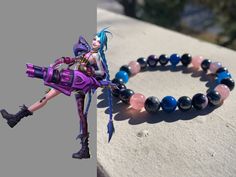 Handmade real crystal bracelet! This piece is modeled after Jinx from League of Legends! It's made with hematite, blue agate (dyed), pink orca agate, strawberry quartz and snowflake obsidian <3 All bracelets are made with an 18cm base size and use stretchy string to create a universal fit for adults! PLEASE NOTE; each piece is made using the same stones but due to the nature of crystals, they will never look the exact same as the last! <3 Arcane Bracelet Ideas, Arcane Crystal, Jinx Bracelet Arcane, Jinx Perler Beads, Arcane Hextech Crystal, Pink Agate Crystal Bracelet As A Gift, Orca Agate, Crystal Bead Bracelet, Jinx League Of Legends